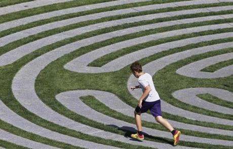 A boy ran along a maze-like installation on the Greenway. 
